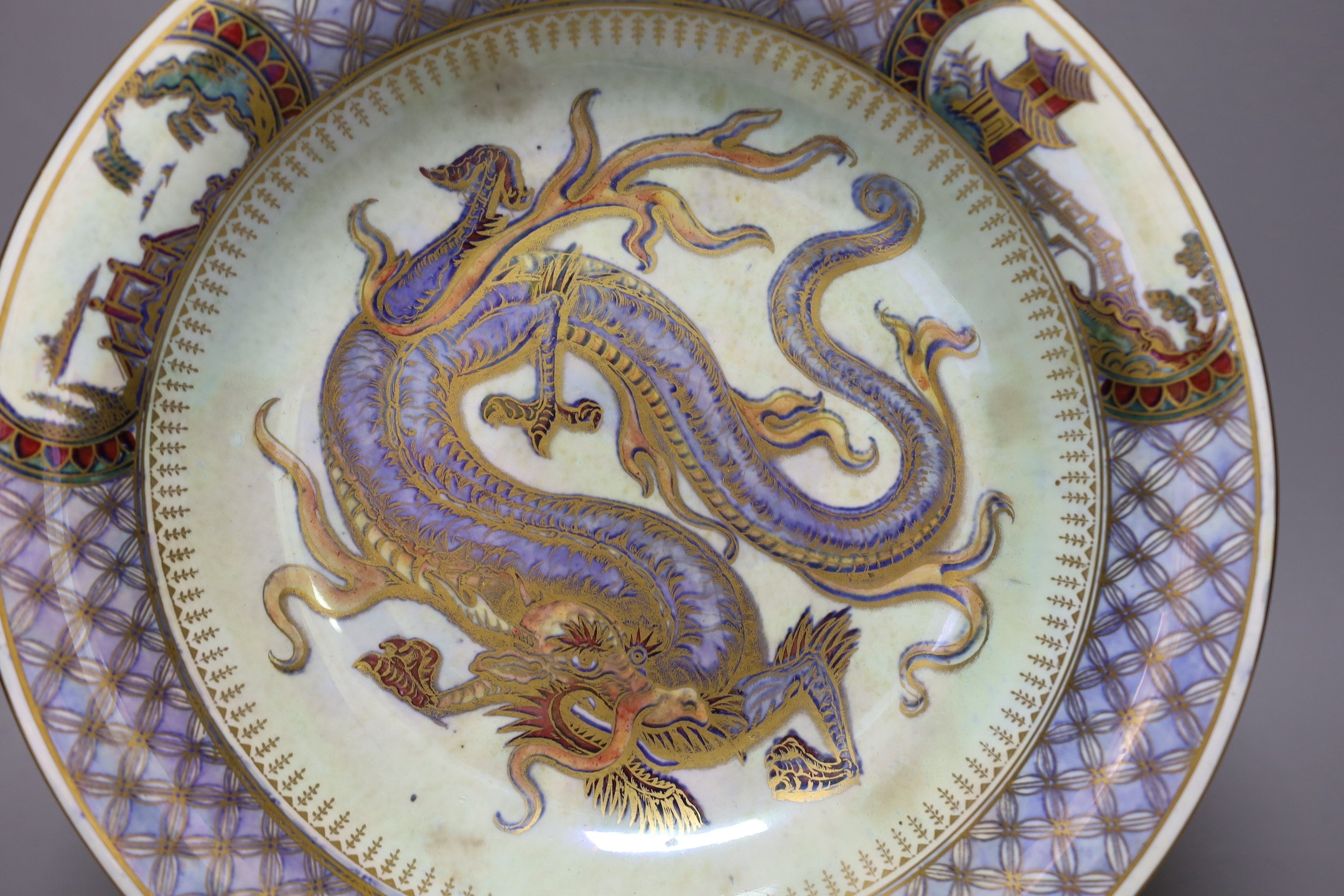 A large Wedgwood lustre dragon shallow bowl, designed by Daisy Makeig-Jones, pattern no. Z4829, 28cms diameter